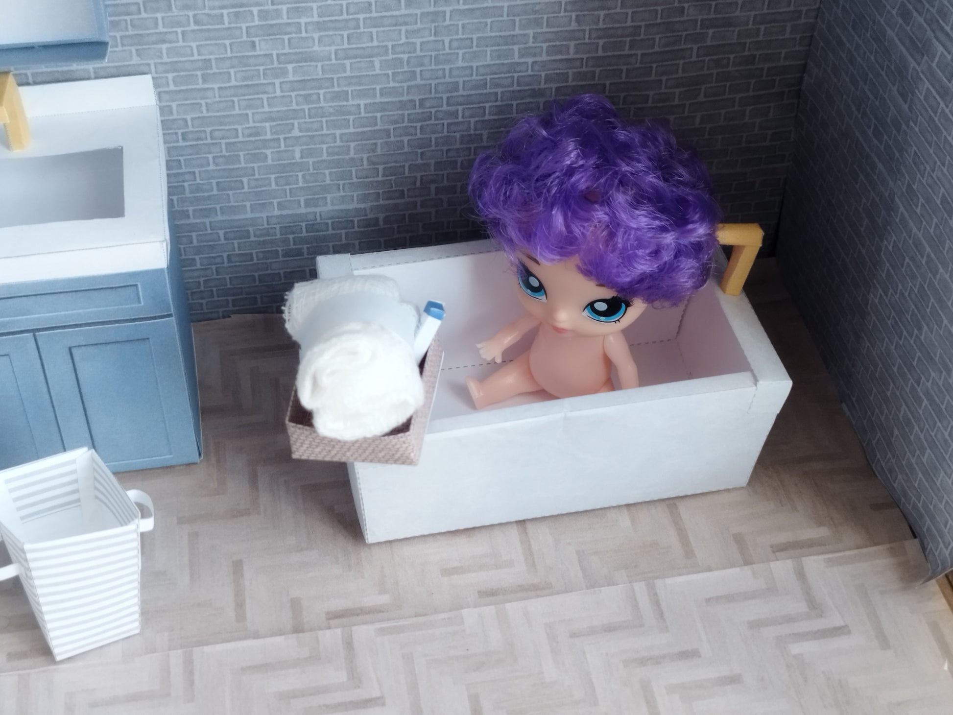 A digital printable template for a 1:12 scale dollhouse bathtub, designed for BMM shoe box bathroom scenes. The template features a detailed, elegant bathtub with clean lines, ready to be printed on regular paper, cut, and assembled for a miniature bathroom setup.