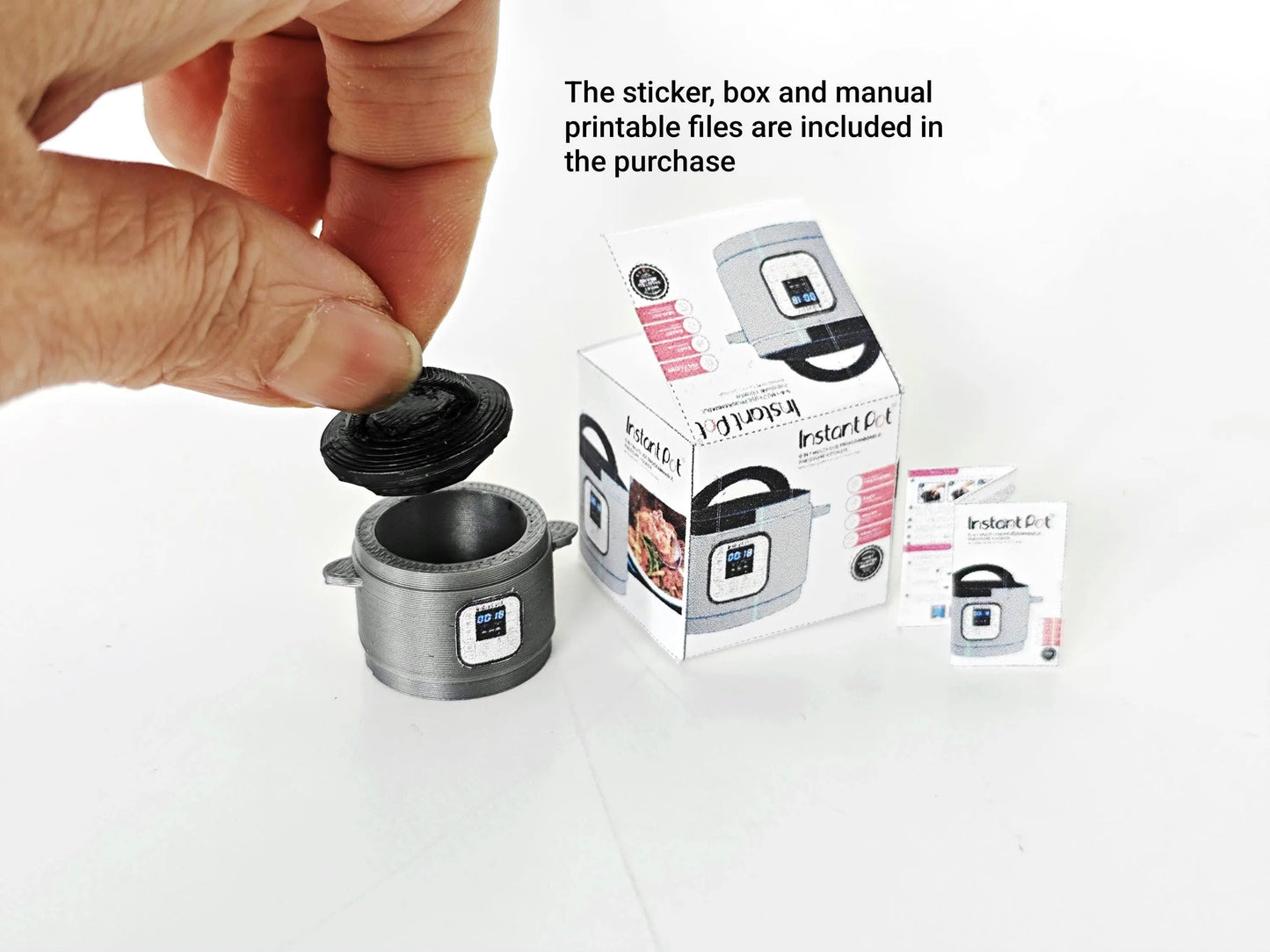"A 3D-printable STL file of a 1:12 scale miniature Instant Pot, featuring detailed buttons and a lid for a realistic dollhouse kitchen appliance