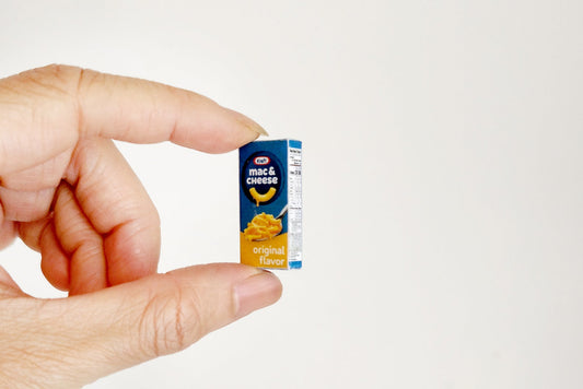 A 1:6 scale printable Kraft Macaroni & Cheese box set for dollhouse use, showcasing detailed packaging for a miniature supermarket or breakfast scene, ideal for DIY diorama kitchen or store displays.