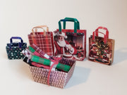 This Christmas Wrapping Paper &amp; Gift Bag Set includes 6 festive wrapping paper designs and 4 coordinating gift bags, perfect for decorating miniature Christmas scenes,