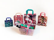 This Christmas Wrapping Paper &amp; Gift Bag Set includes 6 festive wrapping paper designs and 4 coordinating gift bags, perfect for decorating miniature Christmas scenes,