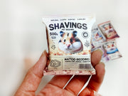 A digital preview of a printable 1:6 scale miniature template kit for dollhouse hamster pet accessories. The kit showcases 7 styles, including colorful hamster food bags, snack packets, wooden chip piles, and cozy pet bedding, arranged for a charming dollhouse pet scene.

