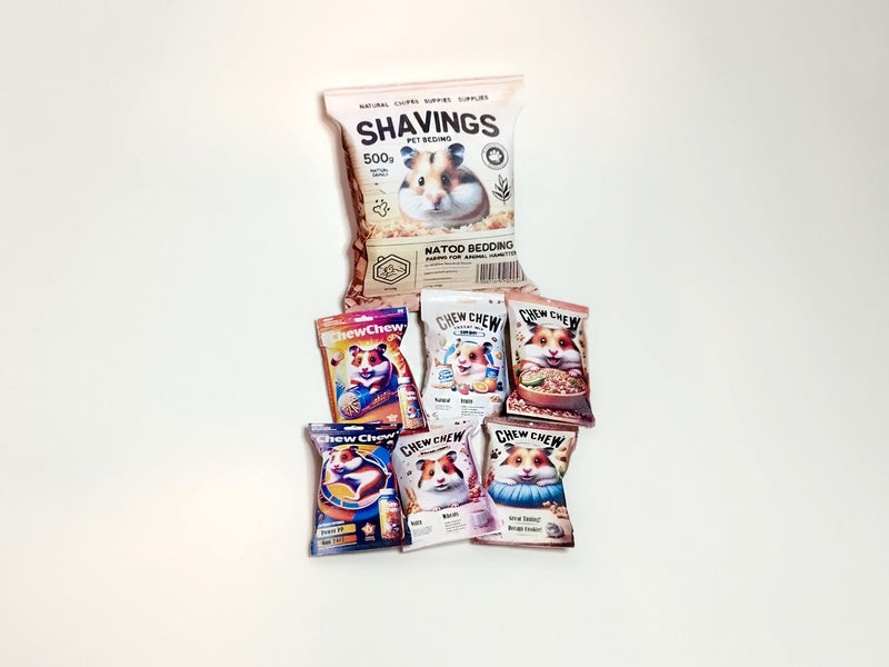 A digital preview of a printable 1:6 scale miniature template kit for dollhouse hamster pet accessories. The kit showcases 7 styles, including colorful hamster food bags, snack packets, wooden chip piles, and cozy pet bedding, arranged for a charming dollhouse pet scene.

