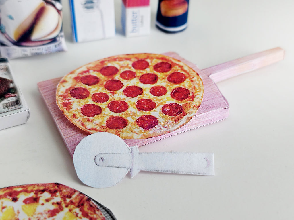 Dollhouse scene featuring 1:6 scale miniature pizzas  in a pizza shop or grocery store setting