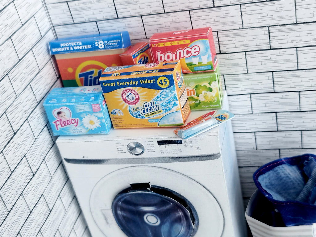 Explore 1:6 and 1:12 scale miniature laundry products for dolls and Barbie dollhouse laundry rooms. Discover 7 unique styles of detergents and accessories, perfect for creating a detailed, realistic miniature project.