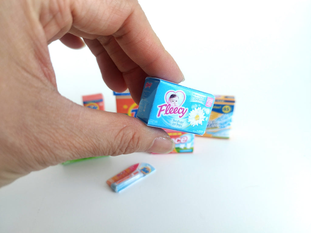 Explore 1:6 and 1:12 scale miniature laundry products for dolls and Barbie dollhouse laundry rooms. Discover 7 unique styles of detergents and accessories, perfect for creating a detailed, realistic miniature project.