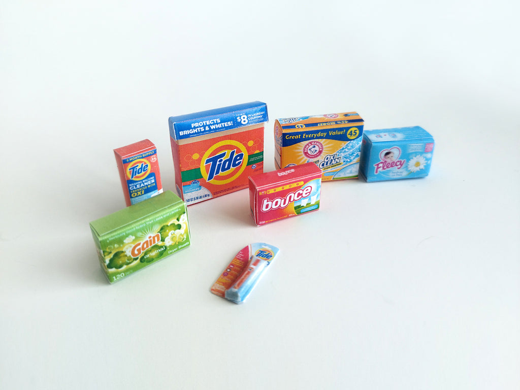 Explore 1:6 and 1:12 scale miniature laundry products for dolls and Barbie dollhouse laundry rooms. Discover 7 unique styles of detergents and accessories, perfect for creating a detailed, realistic miniature project.