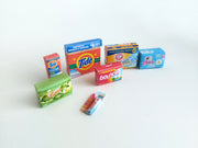 Explore 1:6 and 1:12 scale miniature laundry products for dolls and Barbie dollhouse laundry rooms. Discover 7 unique styles of detergents and accessories, perfect for creating a detailed, realistic miniature project.
