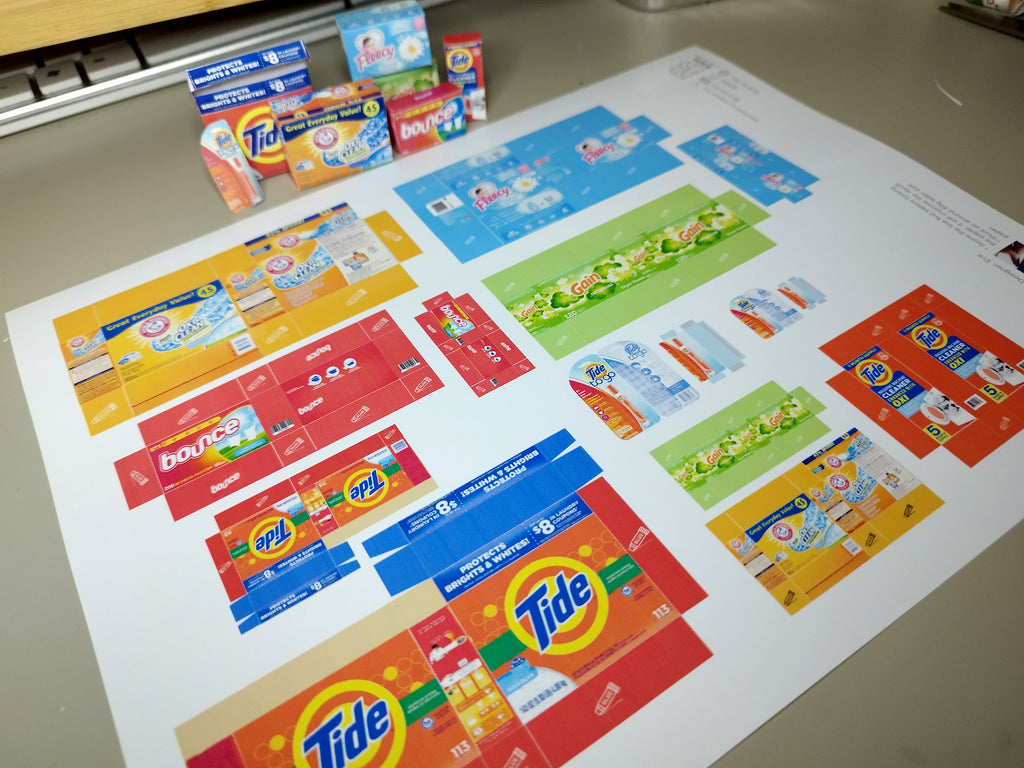 Explore 1:6 and 1:12 scale miniature laundry products for dolls and Barbie dollhouse laundry rooms. Discover 7 unique styles of detergents and accessories, perfect for creating a detailed, realistic miniature project.