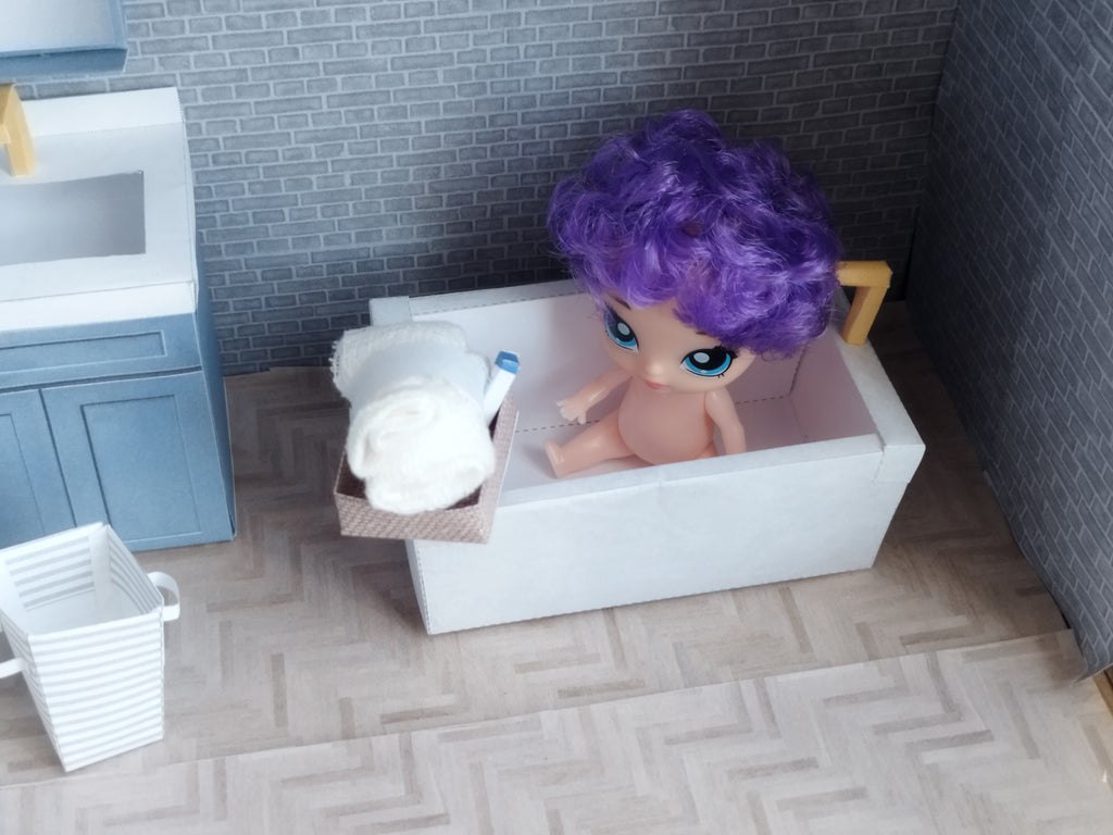 A digital printable template for a 1:12 scale dollhouse bathtub, designed for BMM shoe box bathroom scenes. The template features a detailed, elegant bathtub with clean lines, ready to be printed on regular paper, cut, and assembled for a miniature bathroom setup.