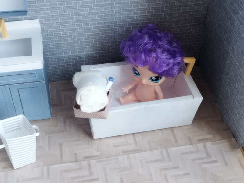 A digital printable template for a 1:12 scale dollhouse bathtub, designed for BMM shoe box bathroom scenes. The template features a detailed, elegant bathtub with clean lines, ready to be printed on regular paper, cut, and assembled for a miniature bathroom setup.