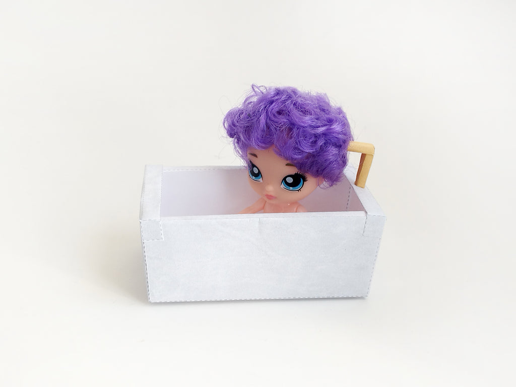 A digital printable template for a 1:12 scale dollhouse bathtub, designed for BMM shoe box bathroom scenes. The template features a detailed, elegant bathtub with clean lines, ready to be printed on regular paper, cut, and assembled for a miniature bathroom setup.
