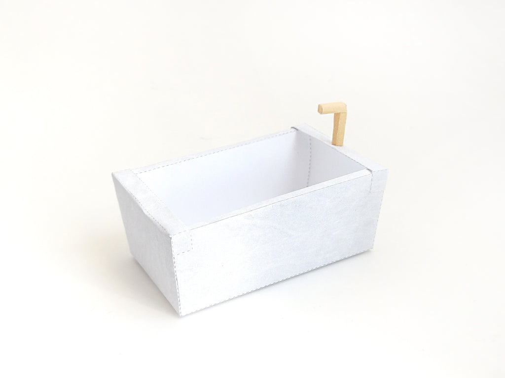 A digital printable template for a 1:12 scale dollhouse bathtub, designed for BMM shoe box bathroom scenes. The template features a detailed, elegant bathtub with clean lines, ready to be printed on regular paper, cut, and assembled for a miniature bathroom setup.