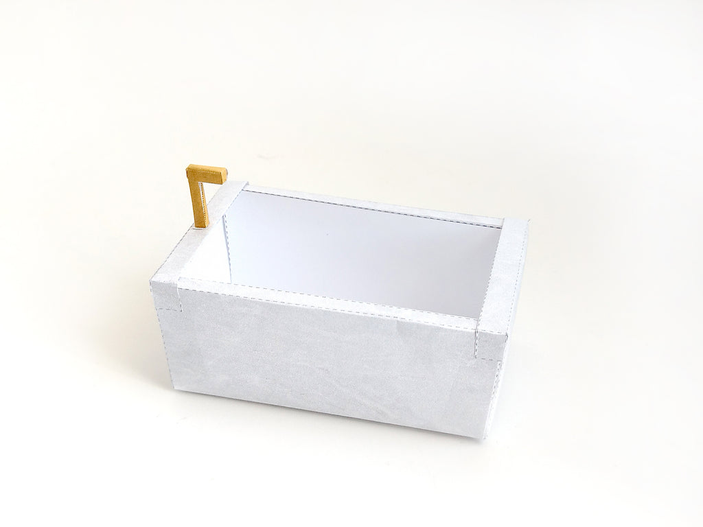 A digital printable template for a 1:12 scale dollhouse bathtub, designed for BMM shoe box bathroom scenes. The template features a detailed, elegant bathtub with clean lines, ready to be printed on regular paper, cut, and assembled for a miniature bathroom setup.