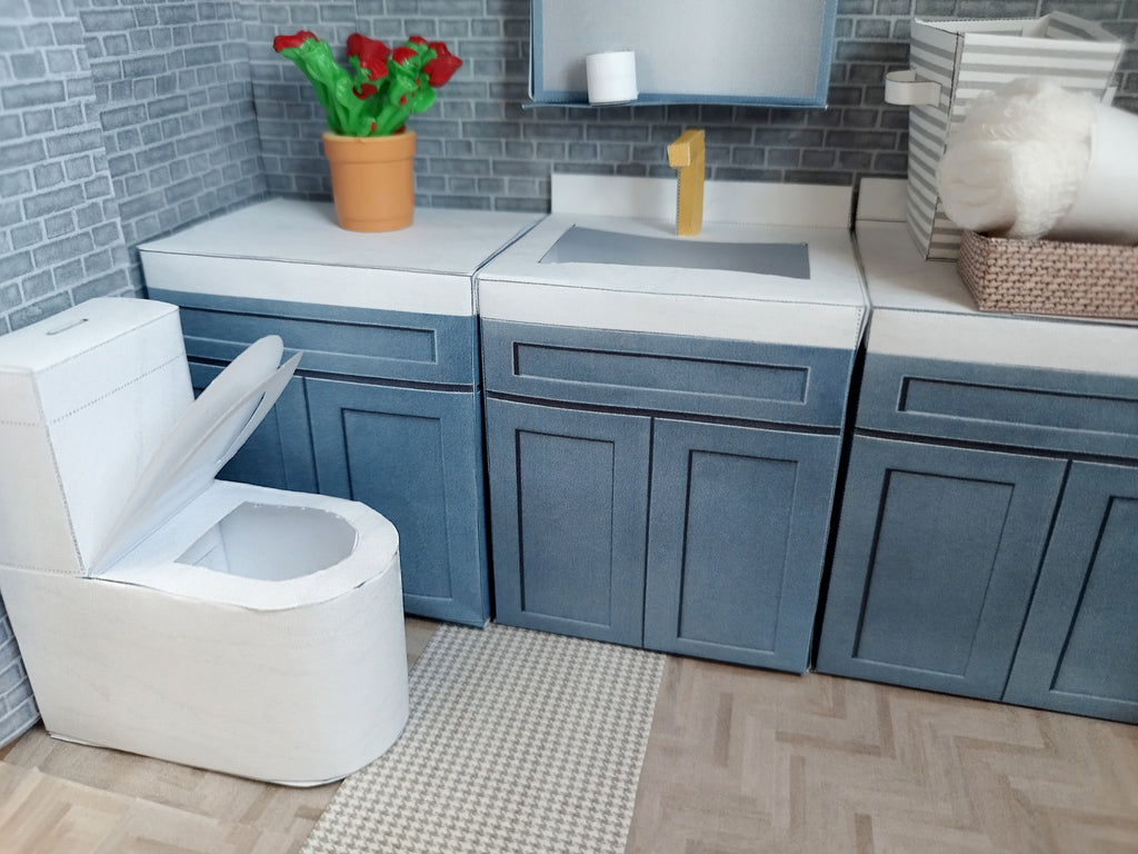 A digital printable template for a 1:12 scale dollhouse white toilet and matching carpet, designed for BMM shoe box bathroom scenes. The template includes a detailed, modern white toilet and a textured carpet, ready to be printed on regular paper, cut, and assembled for a miniature bathroom setting.


