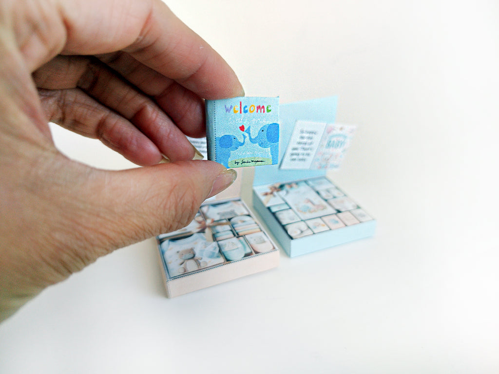 Adorn your dollhouse or baby shower cake with our adorable 1:6 Baby Clothes Set and Book!