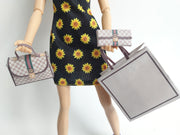 A 1:6 scale printable dollhouse set featuring four luxury brand-inspired brown shopping bags, a purse, and boxes, designed for department store or luxury home decor dioramas, ideal as yearly ornaments for miniature scenes.