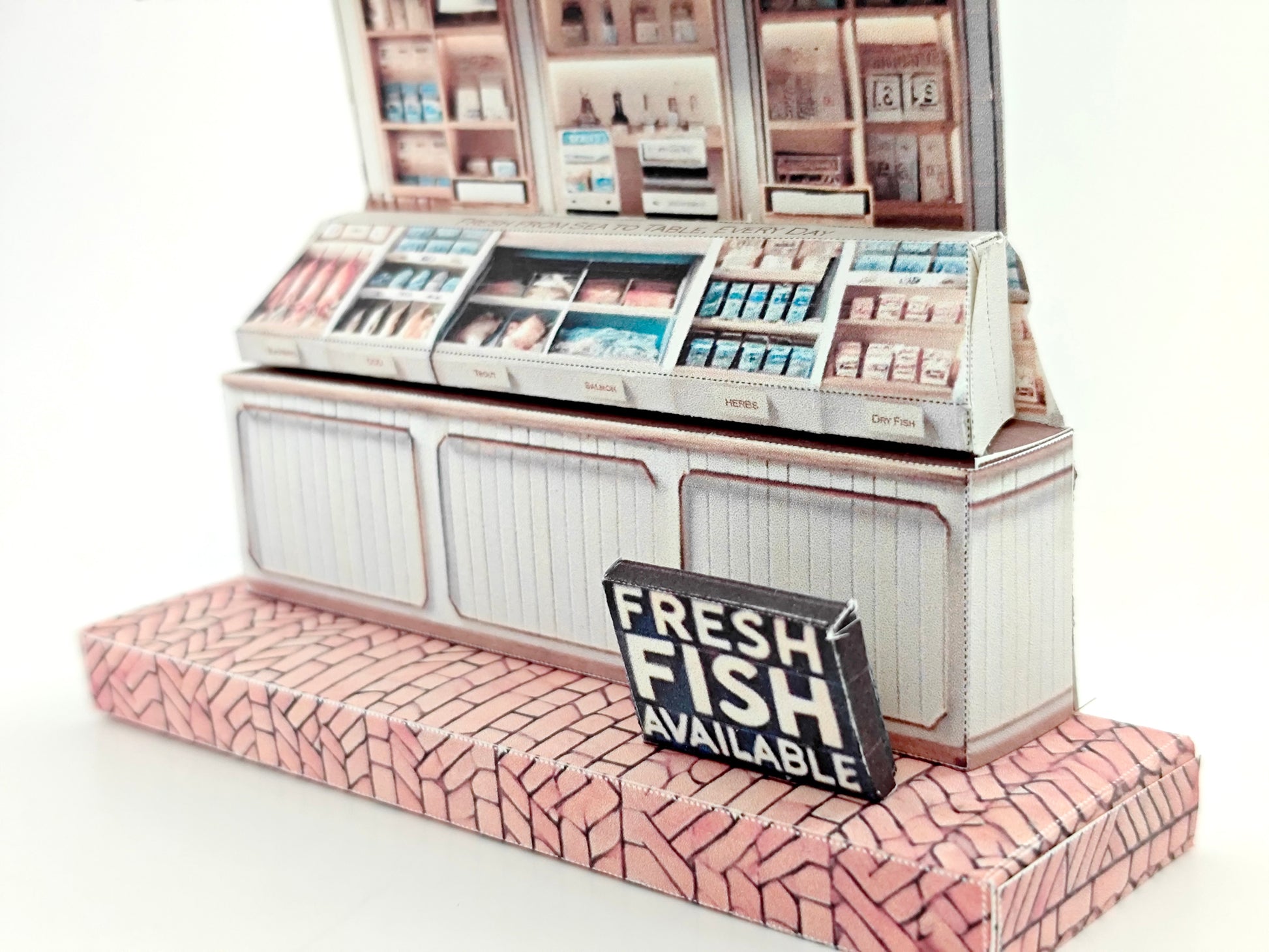 Whether as a wall decoration or a heartfelt gift, this customizable template lets you create a personalized tribute to the charm of a fish shop stand. Perfect for any occasion, this printable template brings creative 3D design to life in the form of a delightful fish shop stand miniature. Download and personalize it for those who appreciate the unique charm of a bustling fish mar