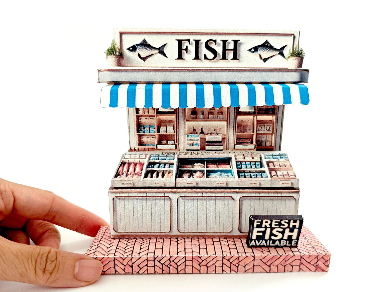Whether as a wall decoration or a heartfelt gift, this customizable template lets you create a personalized tribute to the charm of a fish shop stand. Perfect for any occasion, this printable template brings creative 3D design to life in the form of a delightful fish shop stand miniature. Download and personalize it for those who appreciate the unique charm of a bustling fish mar