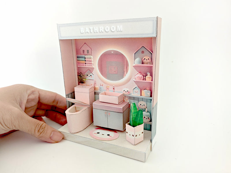 Whether as a decorative piece or a heartfelt gift, this customizable template allows you to create an adorable bathroom in miniature form. Perfect for any occasion, this DIY kit brings the charm of a cozy bathroom to life with intricate details. Download, assemble, and personalize this miniature house kit for those who appreciate the soothing and refreshing atmosphere of a well-designed bathroom.
