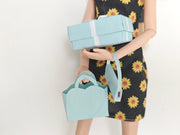 Enhance your dollhouse or department store with this 1:6 scale 5-item Sea Blue Purse and Gift Box set in black and sea blue tones. Ideal as a yearly ornament, perfect for stylish miniature displays and collectors
