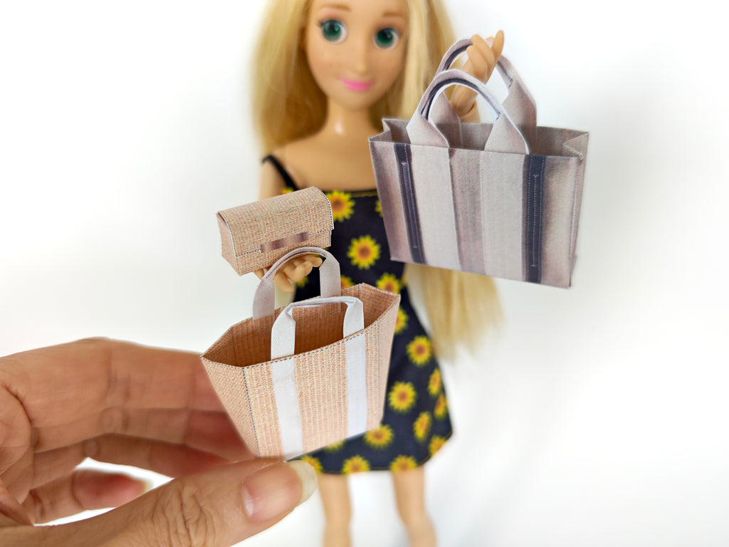 Add flair to your dollhouse or diorama with this 1:6 scale set of 3 linen tote shopping bags, including grocery bags, mini bags, and a mini wallet. Perfect for miniature department store scenes and collectors.
This printable miniatures is available in a 1:6 play scale, perfect for enhancing your doll and miniature playing experience.

