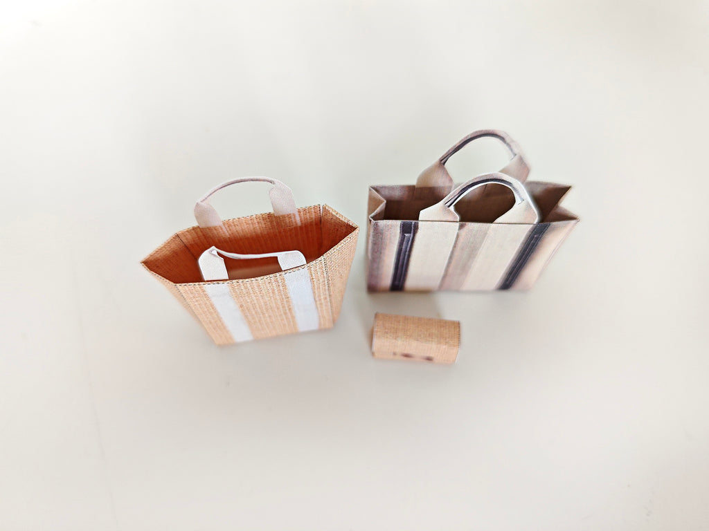 Add flair to your dollhouse or diorama with this 1:6 scale set of 3 linen tote shopping bags, including grocery bags, mini bags, and a mini wallet. Perfect for miniature department store scenes and collectors.
This printable miniatures is available in a 1:6 play scale, perfect for enhancing your doll and miniature playing experience.

