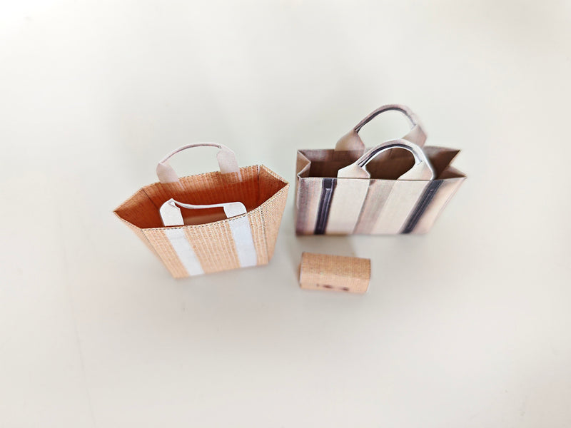 Add flair to your dollhouse or diorama with this 1:6 scale set of 3 linen tote shopping bags, including grocery bags, mini bags, and a mini wallet. Perfect for miniature department store scenes and collectors.
This printable miniatures is available in a 1:6 play scale, perfect for enhancing your doll and miniature playing experience.

