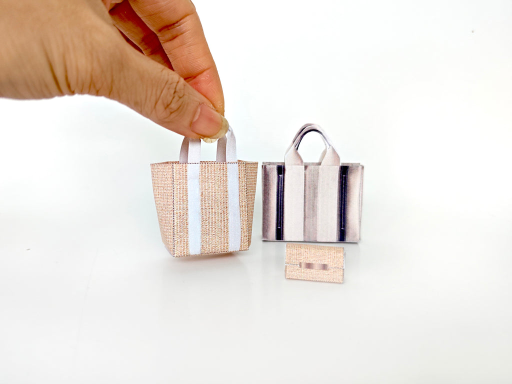 Add flair to your dollhouse or diorama with this 1:6 scale set of 3 linen tote shopping bags, including grocery bags, mini bags, and a mini wallet. Perfect for miniature department store scenes and collectors.
This printable miniatures is available in a 1:6 play scale, perfect for enhancing your doll and miniature playing experience.

