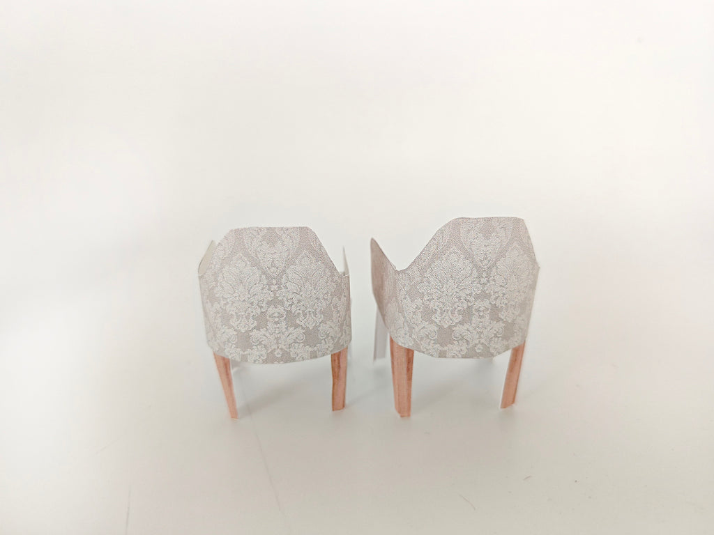 A 1:12 scale printable dollhouse furniture set from BMM Shoebox Miniature, featuring a dining table and chairs, crafted as DIY templates for a miniature living room or dining scene, ideal for diorama customization.