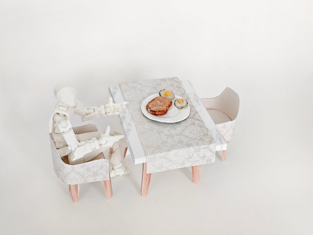 A 1:12 scale printable dollhouse furniture set from BMM Shoebox Miniature, featuring a dining table and chairs, crafted as DIY templates for a miniature living room or dining scene, ideal for diorama customization.
