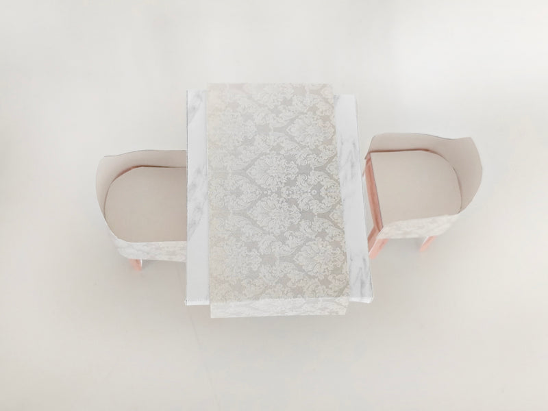 A 1:12 scale printable dollhouse furniture set from BMM Shoebox Miniature, featuring a dining table and chairs, crafted as DIY templates for a miniature living room or dining scene, ideal for diorama customization.