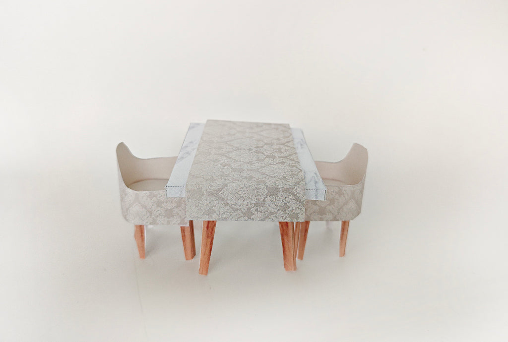 A 1:12 scale printable dollhouse furniture set from BMM Shoebox Miniature, featuring a dining table and chairs, crafted as DIY templates for a miniature living room or dining scene, ideal for diorama customization.