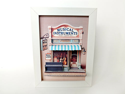 A 3D-printable STL or instant download template of a 5x7-inch pop-up frame depicting a musical instrument shop, designed with layered details for a miniature shadow box display.

