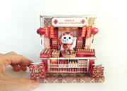 A 3D-printable STL file of a 1:12 scale Chinese New Year Lunar Fortune Cat stand DIY kit, featuring a detailed fortune cat on a stand for a dollhouse festive display

