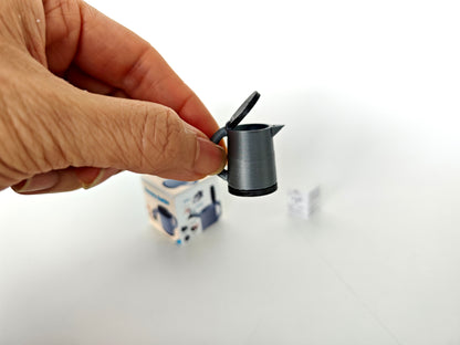 "A 3D-printable STL file of a 1:12 scale miniature electric kettle with an openable lid, featuring detailed buttons and a spout for a realistic dollhouse kitchen.

