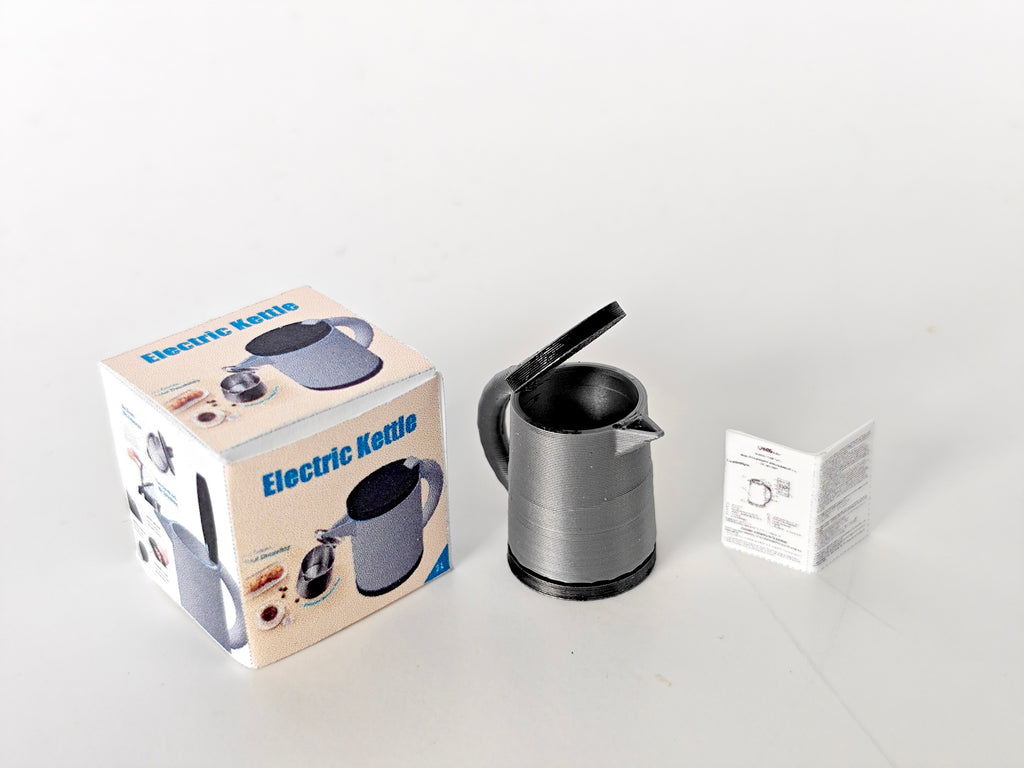 A 3D-printable STL file of a 1:12 scale miniature electric kettle with an openable lid, featuring detailed buttons and a spout for a realistic dollhouse kitchen.