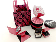 A 3D-printable STL file of a 1:6 scale Valentine’s Day gift set, featuring a flower gift box, romantic cards, rose bags, and an engagement ring, designed as charming dollhouse accessories for a miniature proposal scene or play scale display.

