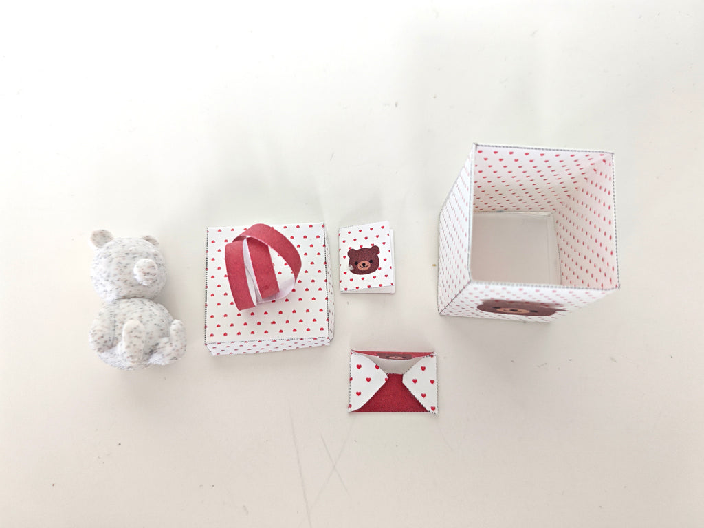 A 3D-printable STL file of a 1:12 scale little bear toy, designed with cute details for a dollhouse Valentine’s Day scene.