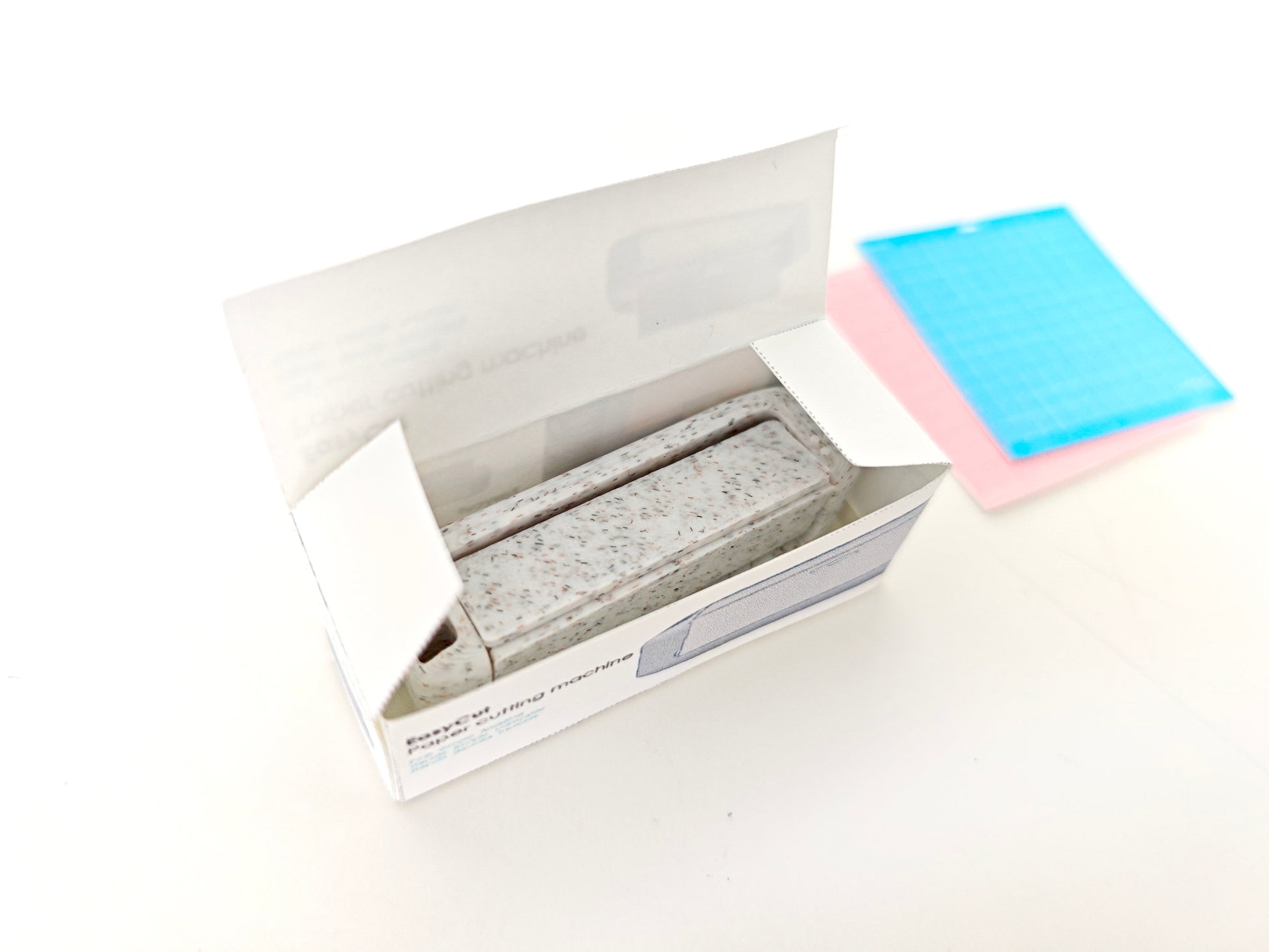 3D-rendered model of a 1:12 scale paper cutting machine with openable and movable parts, designed for 3D printing in STL format."

