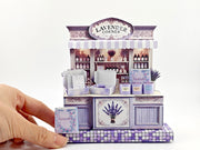 Discover the charm of Lavender Shop Miniature Stand, your one-stop shop for delightful minis and handmade treasures. Indulge in our artisan soaps, candles, and perfumes, or refresh your space with our odor removal bags. Get creative with our miniature kits and paper crafting supplies, perfect for crafting unique frame displays. Handcrafted with love, our products bring a touch of lavender magic to your home!
