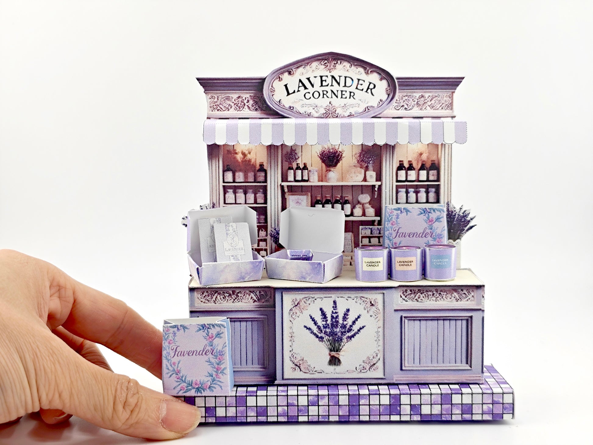 Discover the charm of Lavender Shop Miniature Stand, your one-stop shop for delightful minis and handmade treasures. Indulge in our artisan soaps, candles, and perfumes, or refresh your space with our odor removal bags. Get creative with our miniature kits and paper crafting supplies, perfect for crafting unique frame displays. Handcrafted with love, our products bring a touch of lavender magic to your home!