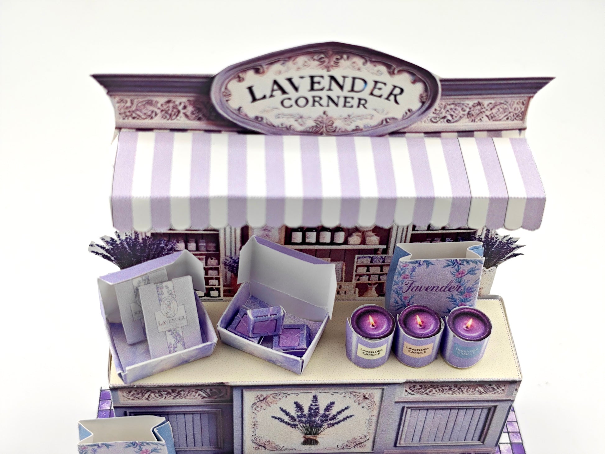 Discover the charm of Lavender Shop Miniature Stand, your one-stop shop for delightful minis and handmade treasures. Indulge in our artisan soaps, candles, and perfumes, or refresh your space with our odor removal bags. Get creative with our miniature kits and paper crafting supplies, perfect for crafting unique frame displays. Handcrafted with love, our products bring a touch of lavender magic to your home!