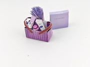 Discover our 1:12 scale lavender gift basket, a charming dollhouse hamper with 11 miniature items including teas, hand cream, soaps, scented fragrance bags, and candles—perfect for a tiny spa retreat