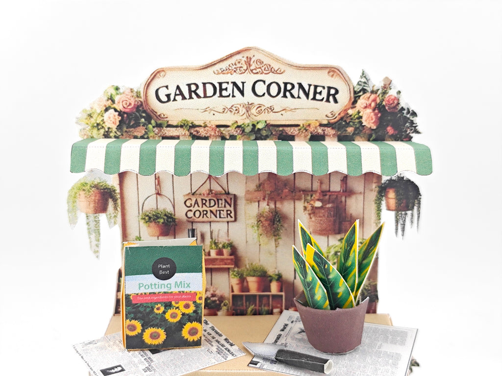 Discover the Garden Corner Miniature Stand: Create your own mini garden with plants, newspaper, potting mix, and pots. This miniature kit includes paper crafting supplies and a 7x5 frame for a charming, DIY display.