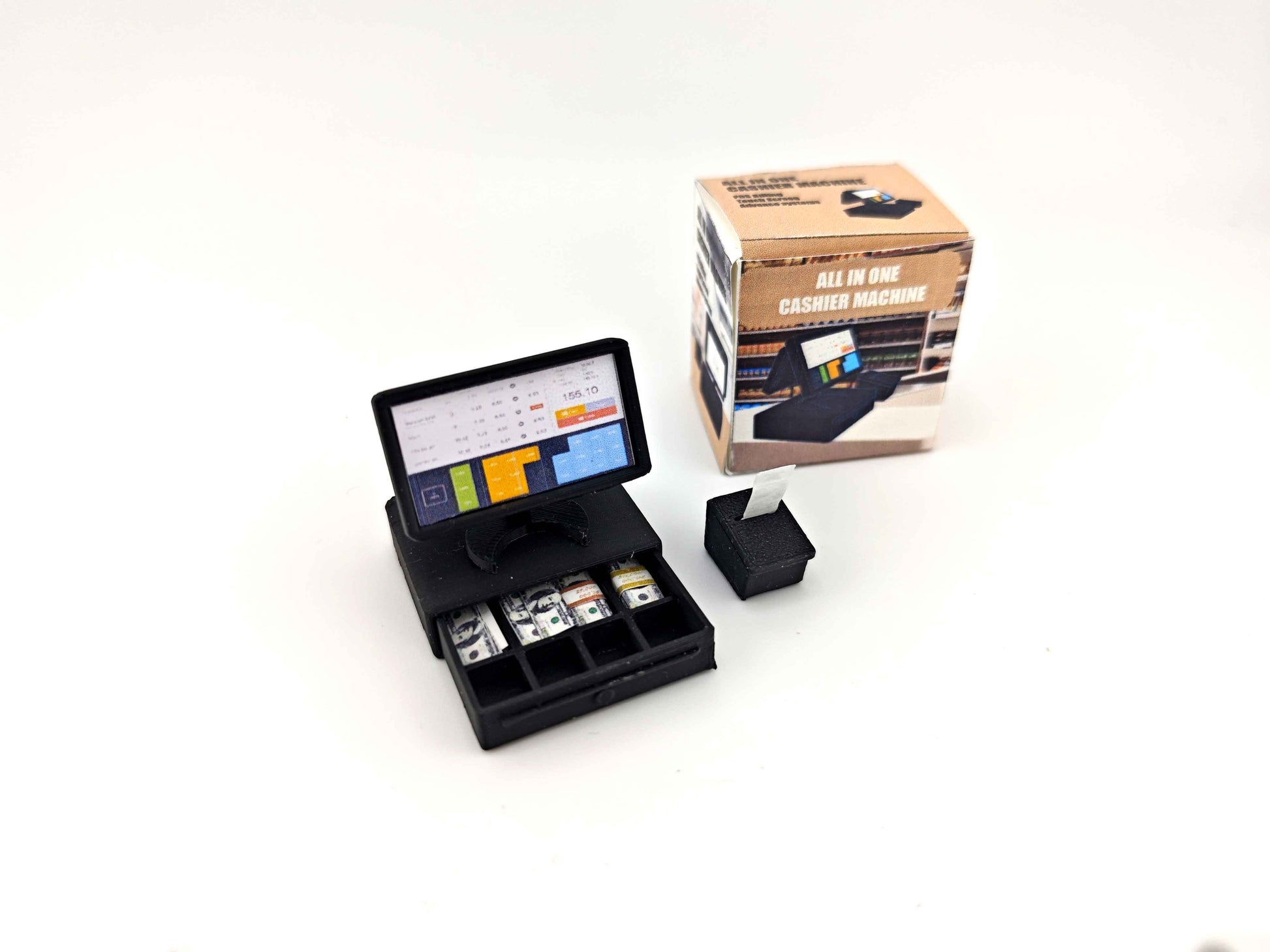 Bring your miniature shop to life with this 1:12 scale all-in-one POS cashier machine! Complete with dual screens, a cash drawer, receipt, and mini money details — perfect for mini marts, doll supermarkets, and store dioramas. A fun and detailed accessory for any dollhouse scene!