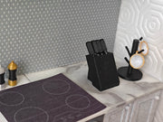 1:12 scale dollhouse knife set with four miniature knives arranged in a compact bamboo knife block, designed for a mini kitchen. The set is a cute, detailed cooking tool, ideal for dollhouse enthusiasts, with a tested STL file for Bamboo Lab 3D printing.