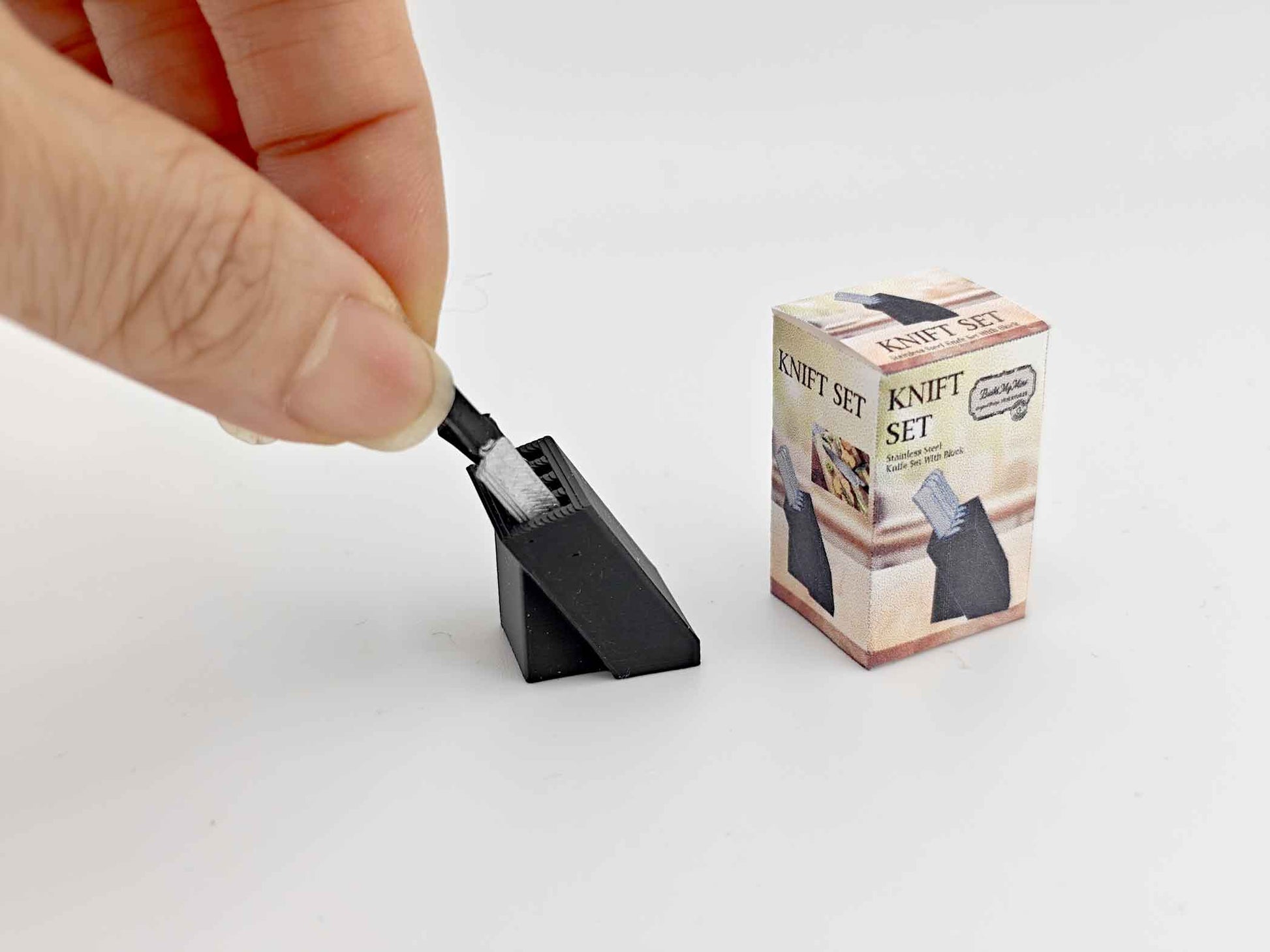 1:12 scale dollhouse knife set with four miniature knives arranged in a compact bamboo knife block, designed for a mini kitchen. The set is a cute, detailed cooking tool, ideal for dollhouse enthusiasts, with a tested STL file for Bamboo Lab 3D printing.