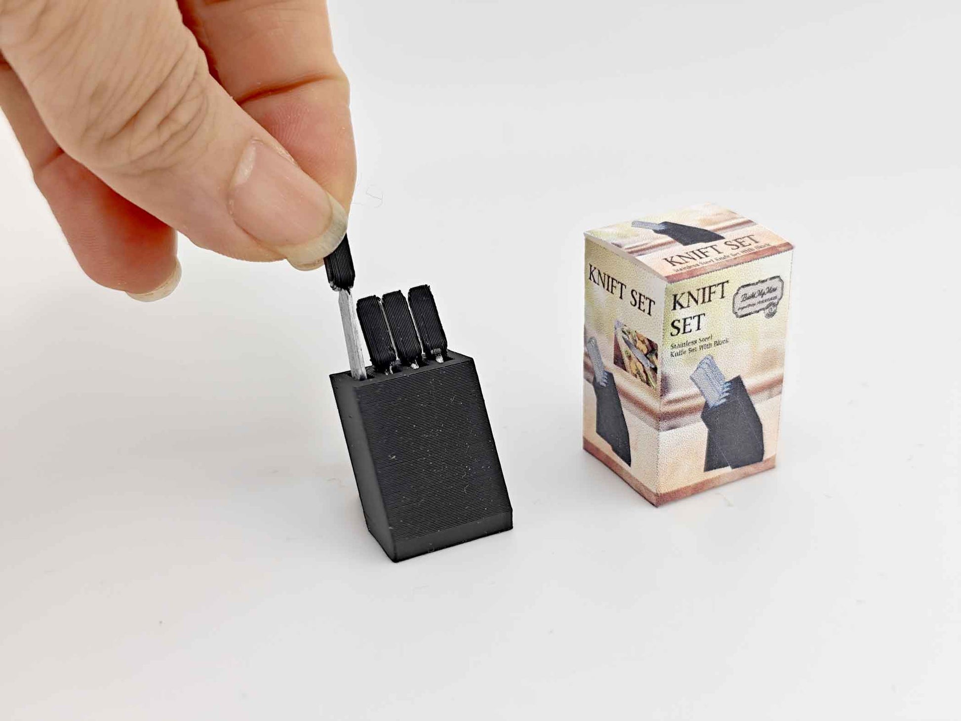 1:12 scale dollhouse knife set with four miniature knives arranged in a compact bamboo knife block, designed for a mini kitchen. The set is a cute, detailed cooking tool, ideal for dollhouse enthusiasts, with a tested STL file for Bamboo Lab 3D printing.