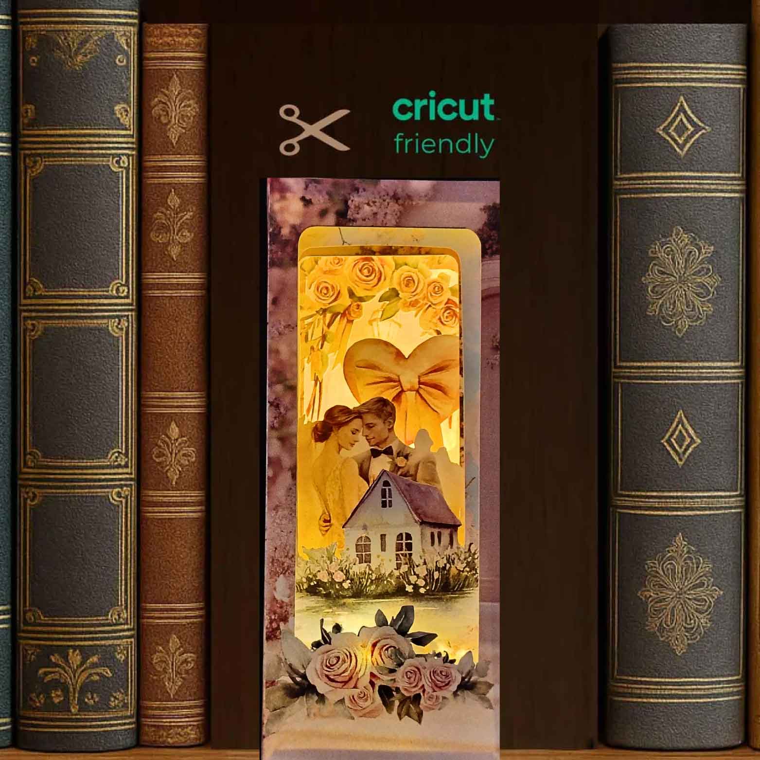 Bridal home book nook paper craft with wedding celebration scene, displayed inside a bookshelf